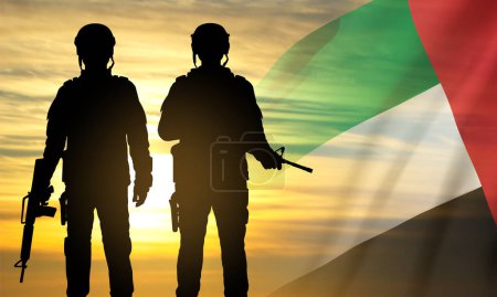 Foto de Silhouette of a soldier on background of the sunrise and UAE flag. Concept for Commemoration Day, Martyrs Day. EPS10 vector - Imagen libre de derechos