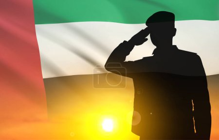 Foto de Silhouette of solider saluting against the flag of UAE. Concept of national holidays. EPS10 vector - Imagen libre de derechos