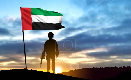 Foto de Silhouette of a soldier on background of the sunrise and UAE flag. Armed forces of United Arab Emirates. Concept for Commemoration Day, Martyrs Day. EPS10 vector - Imagen libre de derechos