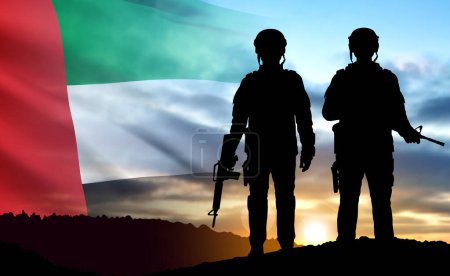 Foto de Silhouette of a soldiers on background of the sunrise and UAE flag. Armed forces of United Arab Emirates. Concept for Commemoration Day, Martyrs Day National Day. EPS10 vector - Imagen libre de derechos