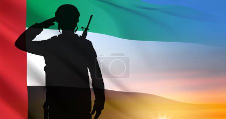 Foto de Silhouette of a solider saluting on background of sunrise and UAE flag. UAE national holidays, National Day, Commemoration Day concept. EPS10 vector - Imagen libre de derechos