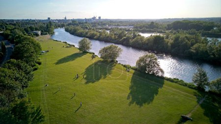 Photo for An aerial view along the Thames river by Thames Valley Park heading into Reading, United Kingdom - 03.06.2023 - Royalty Free Image