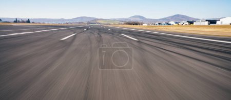 Photo for Race Car / motorcycle racetrack after rain on a sunny day. Fast motion blur effect. Ready to race - Royalty Free Image