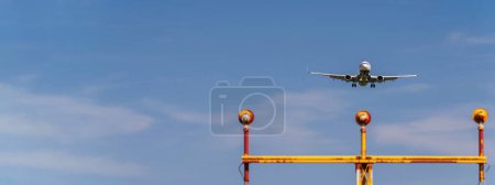Photo for Commercial airplane landing on mallorca airport - Royalty Free Image