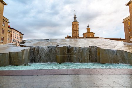 La Fuente del Hispanidad, the Spanish Fountain at Plaza del Pilar and church of San Juan de los Panetes in Zaragoza, Spain.