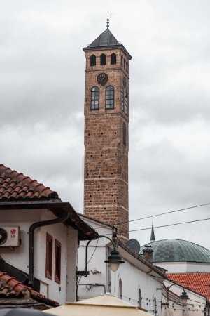 Sarajevo - BiH - 11 FEB 2024: The Sarajevski Sahat Kula is an Ottoman clock tower in Sarajevo, the capital of Bosnia and Herzegovina.