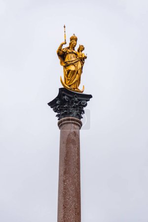 Virgin Mary's Column or Mariensaule at the famous square of Marienplatz in Munich, Bavaria, Germany.