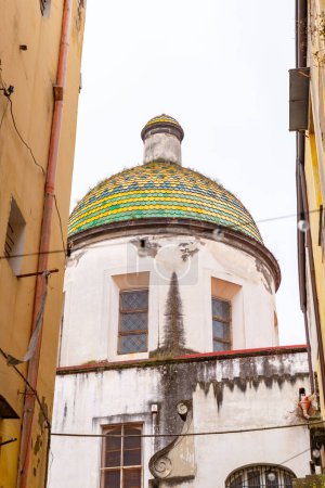 Ceramic tile covered dome of a church at Via Tribunali in Naples, Campania, Italy.