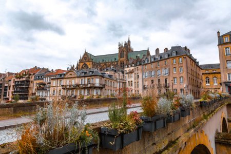 Cityscape view from the beautiful city of Metz in France. Bridges, houses and churches on the bank of the Moselle River. Pont St. Marcel.