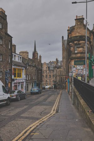 Photo for View from George IV Bridge towards Candlemaker Row Street alongside  historic buildings in Edinburgh, Scotland, UK - Royalty Free Image