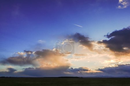 Photo for Wonderful colorful clouds on blue sky after rain and storm in the spring - Royalty Free Image