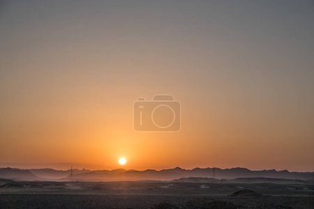 warm bright sun with mountains in the desert during sunset in egypt