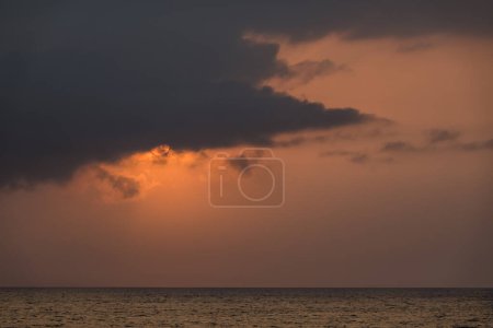 warm sun behind a dark cloud in the morning from egypt