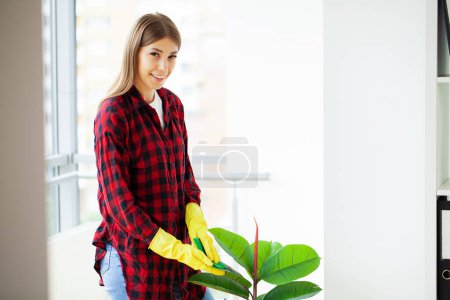 Photo for Portrait of happy female worker cleaning modern office. - Royalty Free Image