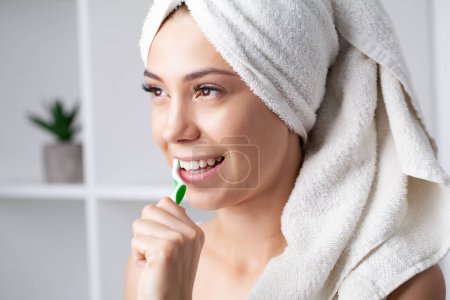 Photo for Healthy white teeth, portrait of beautiful young woman brushing teeth. - Royalty Free Image