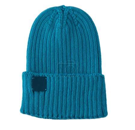 Demi-season blue ribbed knitted hat isolated on white background. Winter new stylish knitted wool headwear blue hat.