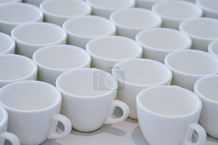 Abstract background of white cups. Dishes top view.