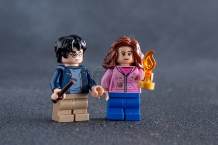 Photo for Lego Harry Potter and Hermione minifigures. Childrens designer toy made of bricks and plastic parts. Ukraine, Kyiv - January 17, 2024. - Royalty Free Image