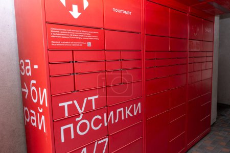 Photo for Receiving mail at the NOVA POSHTA parcel terminal. Contactless sending and delivery of correspondence. Ukraine, Kyiv - March 23, 2024 - Royalty Free Image