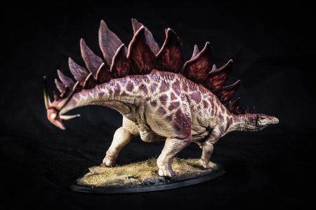Photo for Dinosaur stegosaurus in the dark - Royalty Free Image