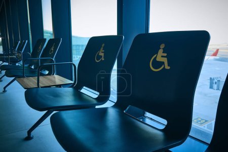 Photo for Empty priority seats for people with disabilities. Disabled person chairs in airport - Royalty Free Image