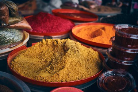Colorful heaps of dried spices at bazaar market
