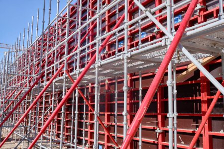 Photo for Vertical panel formwork, push-pull jacks and scaffoldings of reinforced concrete walls under construction. Structures for cast in place reinforced concrete - Royalty Free Image