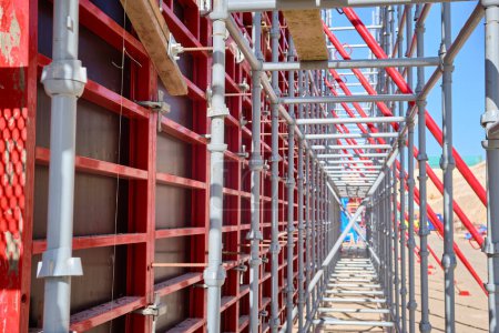 Photo for Vertical panel formwork, push-pull jacks and scaffoldings of reinforced concrete walls under construction. Structures for cast in place reinforced concrete - Royalty Free Image