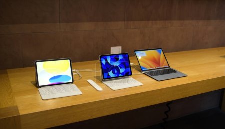 Photo for Paris, France - Oct 28, 2022: Apple store showcase with new iPad redesigned model, ipad Pro and macBook pro laptop - Royalty Free Image