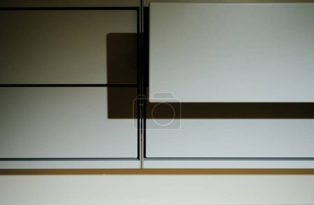 Photo for London, United Kingdom - Jan 1, 2022: Modern luxury furniture - open drawer of 606 Universal Shelving System by Vitsoe - shadow play - Royalty Free Image