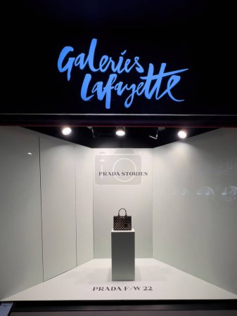 Photo for Strasbourg, France - nov 11, 2022: Large showcase window of Galeries Lafayette with Prada leather women bag - Royalty Free Image