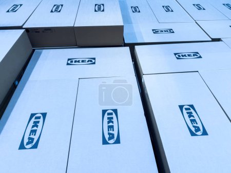 Photo for Paris, France - Oct 26, 2022: Blue color cast over multiple Ikea logotype insignia on multiple cardboard boxes inside furniture store - Royalty Free Image
