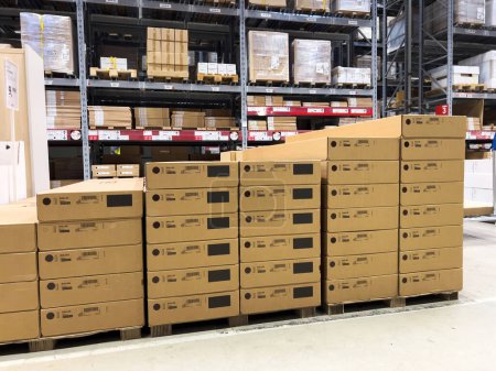 Photo for Paris, France - Oct 26, 2022: Arranged one above another Ikea Kallax cardboard boxes with large warehouse in background - Royalty Free Image