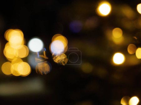 Photo for Defocused blur view of christmas lights bokeh - Royalty Free Image