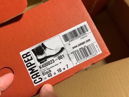 Foto de London, October 20, 2022: Looking at the shoe description of new brand modern Camper Bowie leather shoes - manufactured by footwear company with headquarters in Mallorca, Spain - Imagen libre de derechos