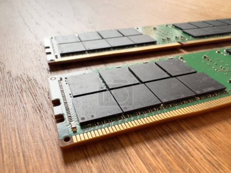 Foto de Close-up of two new computer RAM Memory module on a wooden table - Imagen libre de derechos