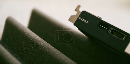 Foto de London, United Kingdom - Aug 5, 2022: Close-up of new Nvidia Quadro RTX A4000 video GPU card on tech background - Imagen libre de derechos