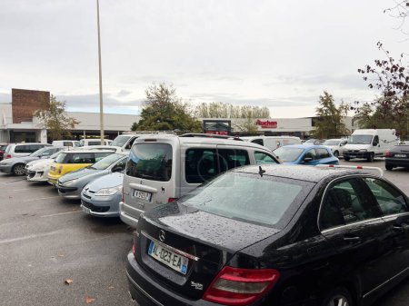 Photo for Strasbourg, France - Oct 21, 2022: Cars parked in a row in front of Auchan Supermakrt in France - no people - Royalty Free Image