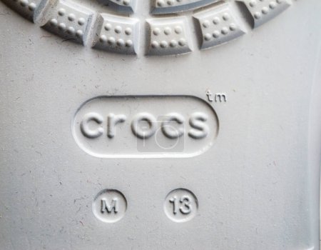 Photo for Paris, France - Dec 2, 2022: Logotype of new Crocs sandals foam clogs M13 size - Royalty Free Image