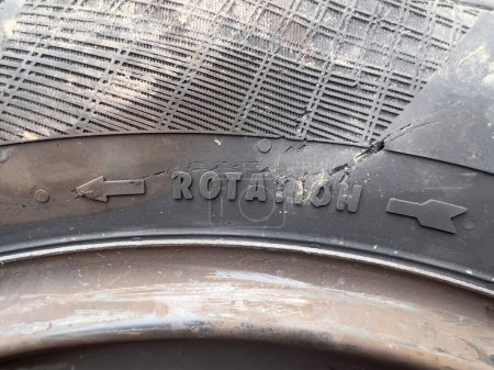 Photo for Rotation arrow on the damaged car tyre tire after accident - Royalty Free Image