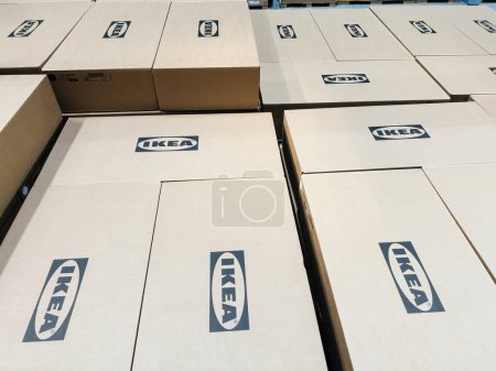 Téléchargez les photos : Paris, France - Oct 26, 2022: Ikea logotype insignia on multiple cardboard boxes inside furniture store - directly above view - en image libre de droit