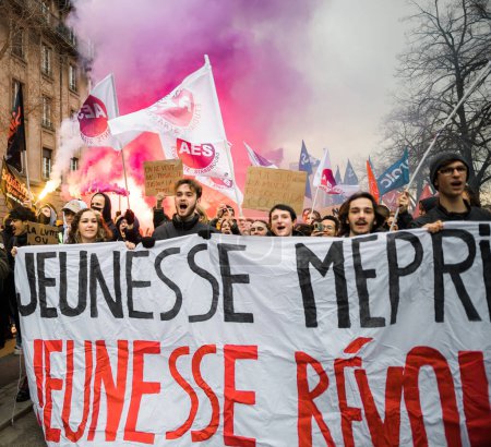 Photo for Strasbourg, France - Jan 19, 2023: Square image large crowd at protest smoke greande people against the French governments planned pension reform to push the retirement age from 62 to 64 unions have - Royalty Free Image