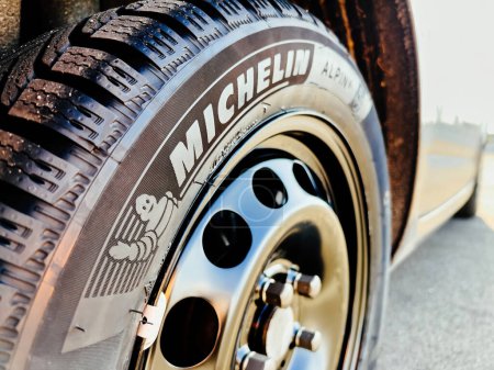 Photo for Clermont-Ferrand, France - Oct 17, 2022: Close-up of new Michelin Alpin 6 Premium touring winter tyre mounted on a new rhim wheel - Royalty Free Image