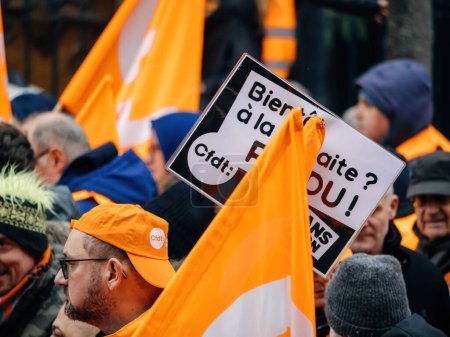 Téléchargez les photos : Strasbourg, France - 31 January 2023: People marching at second demonstration against the new pension reform to be presented next month by French Prime Minister Elisabeth Borne - en image libre de droit