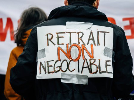 Photo for Strasbourg, France - 31 January 2023: retirement is not negociable palcard at second demonstration against the new pension reform to be presented next month by French Prime Minister Elisabeth Borne - Royalty Free Image