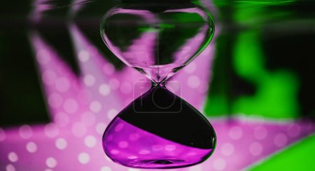 Photo for Cyan vintage sand timer with defocused star bokeh lights background concept of time passing - Royalty Free Image