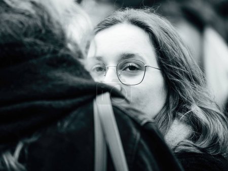 Photo for Strasbourg, France - 31 January 2023: Black and white portarit of woman at second demonstration against the new pension reform to be presented next month by French Prime Minister Elisabeth Borne - Royalty Free Image