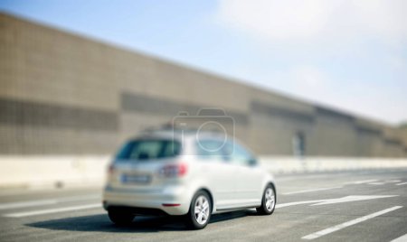 Photo for Defocused view of car driving fast on Austrian highway on a clear sky day - Royalty Free Image