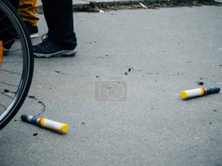 Téléchargez les photos : Strasbourg, France - 31 January 2023: Smoke grenades left on ground at second demonstration against the new pension reform to be presented next month by French Prime Minister Elisabeth Borne - en image libre de droit