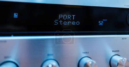 Foto de Port stereo text on the LCD display aluminum facade figh-end stereo audio hi-fi receiver with multiple knobs - close-up tilt-shift lens used - Imagen libre de derechos